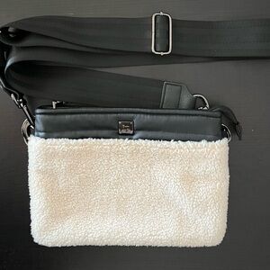 Crossbody Bag Think Royln Bum Bag 2.0 with a black and cream sherpa exterior.